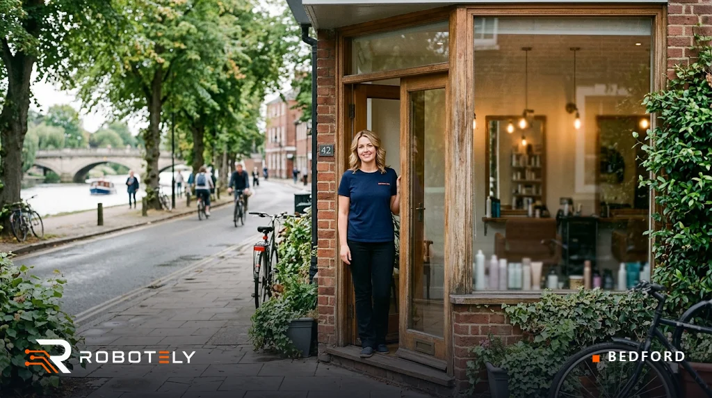 Hairdresser outside her salon in Bedford
